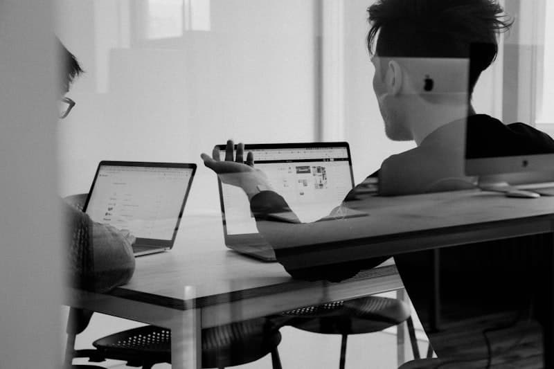 Customer support team working together at a modern desk